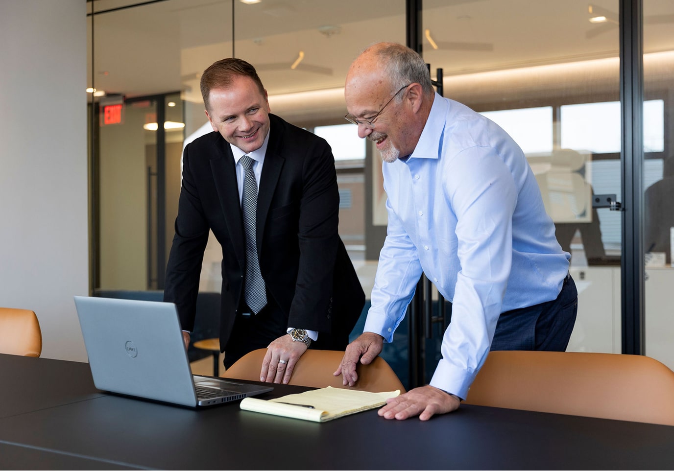 Fletcher consulting two team members collaborating together