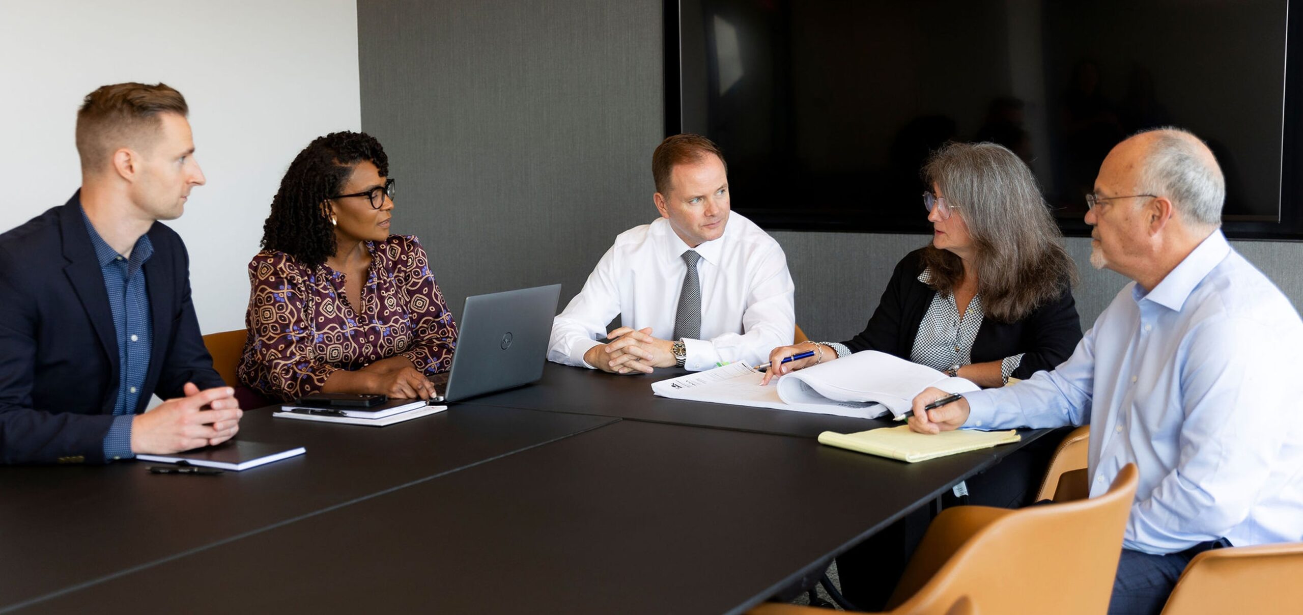 Fletcher Consulting Team working in conference room